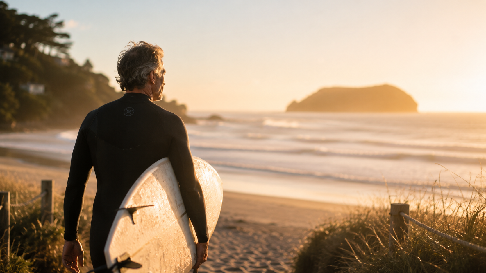 Business owner at the beach at sunrise, Aotearoa New Zealand